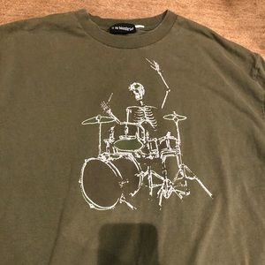 Distressed Skeleton playing drums Green Olive Tee